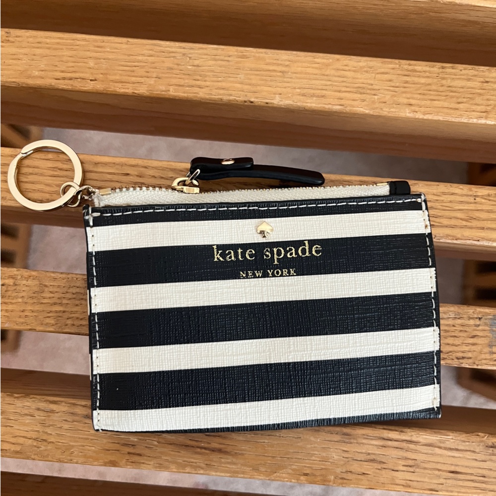 black and white striped card holder with gold details from kate spade